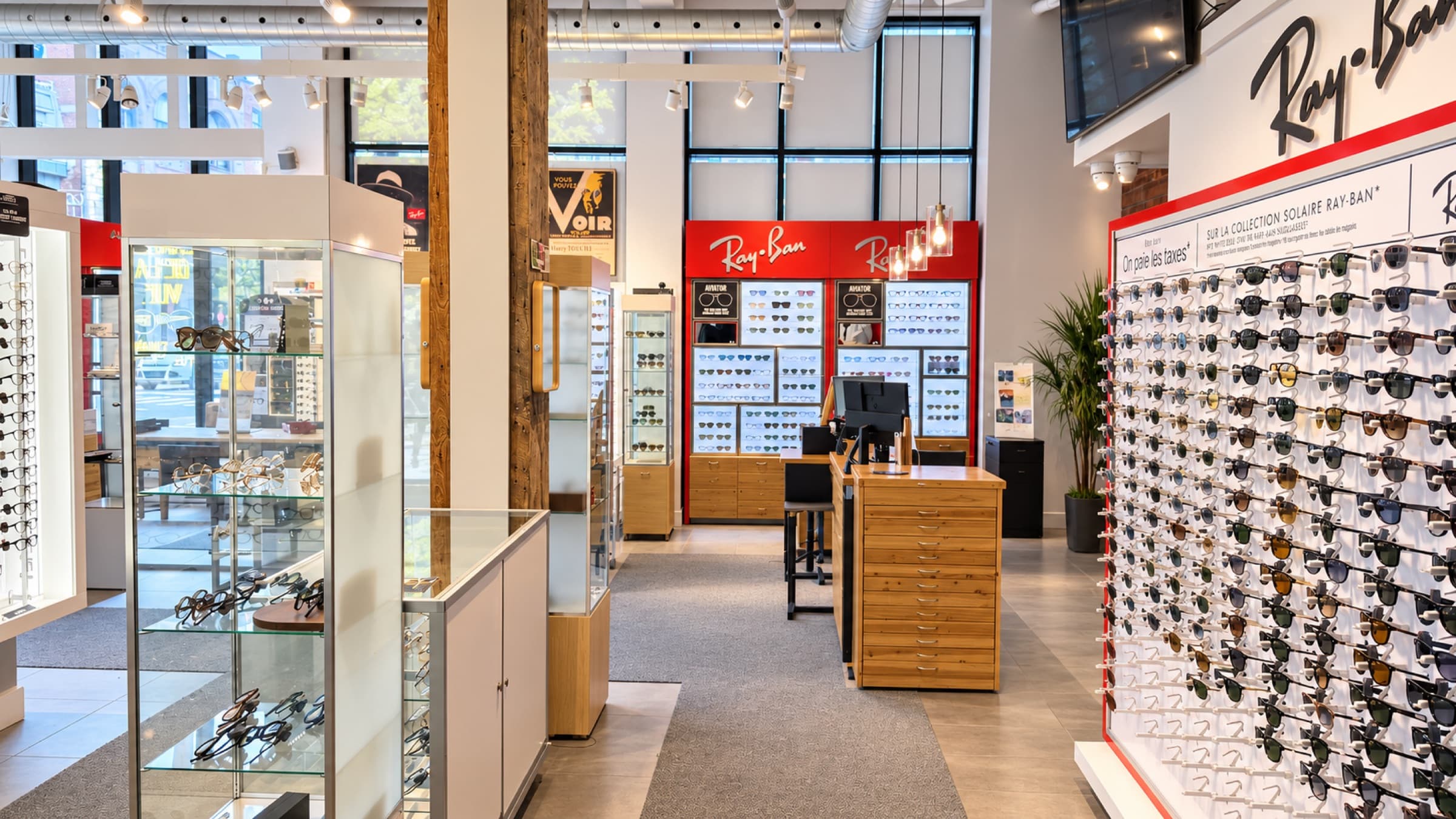 The centre aisle between the frame cases, down to the Ray-Ban wall.